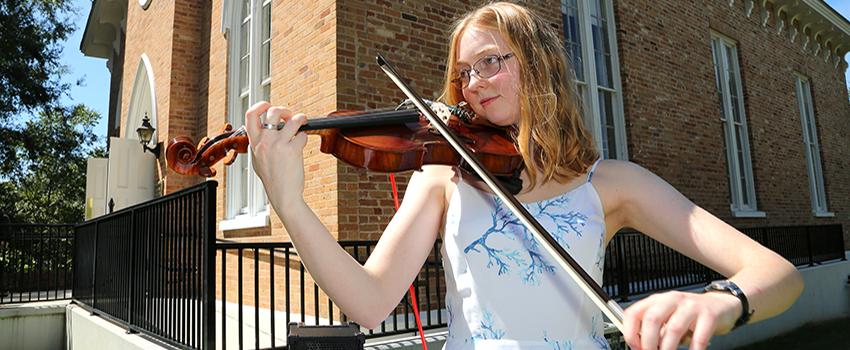 Honors student playing violin